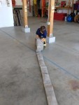 Kid rolls hose